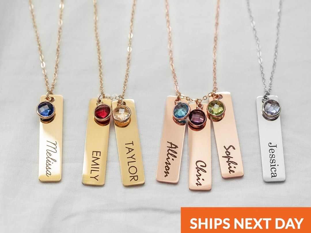 Geopersonalized engraved kids-name charms beside birthstones on a gold chain for mom
