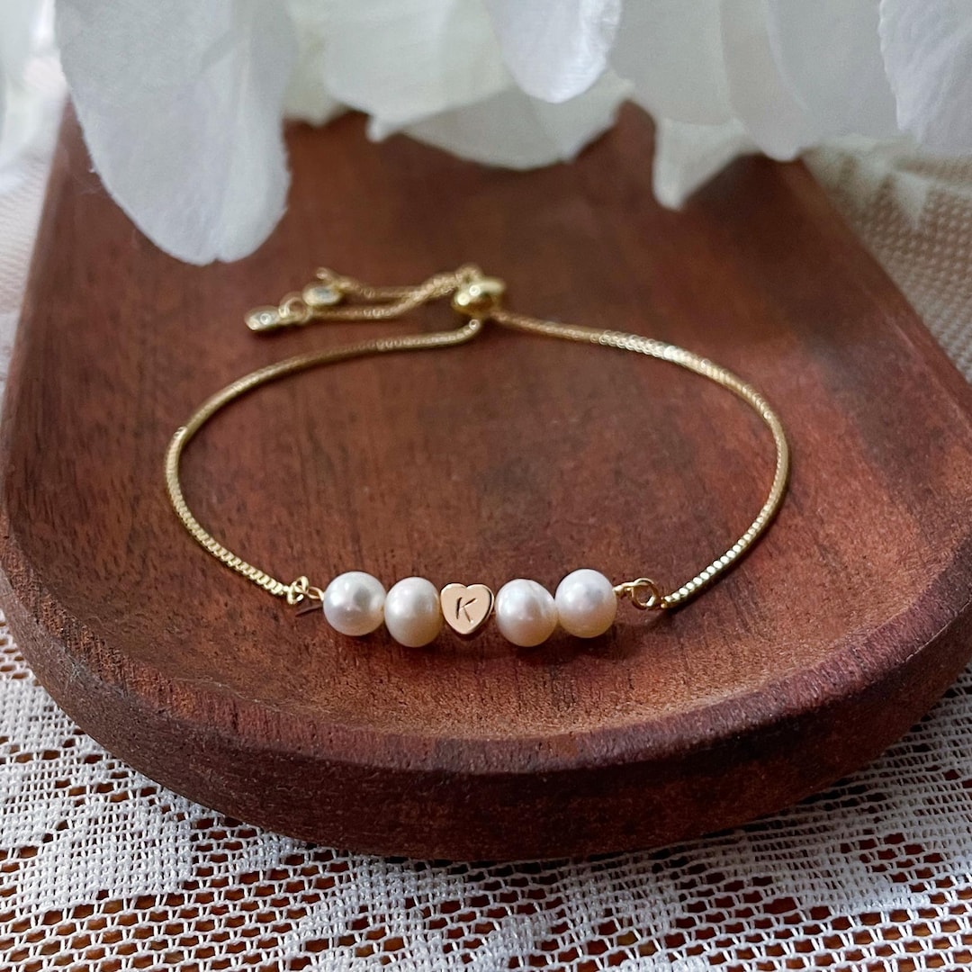MonicaChicShop freshwater pearl friendship bracelet in gold on a pale background