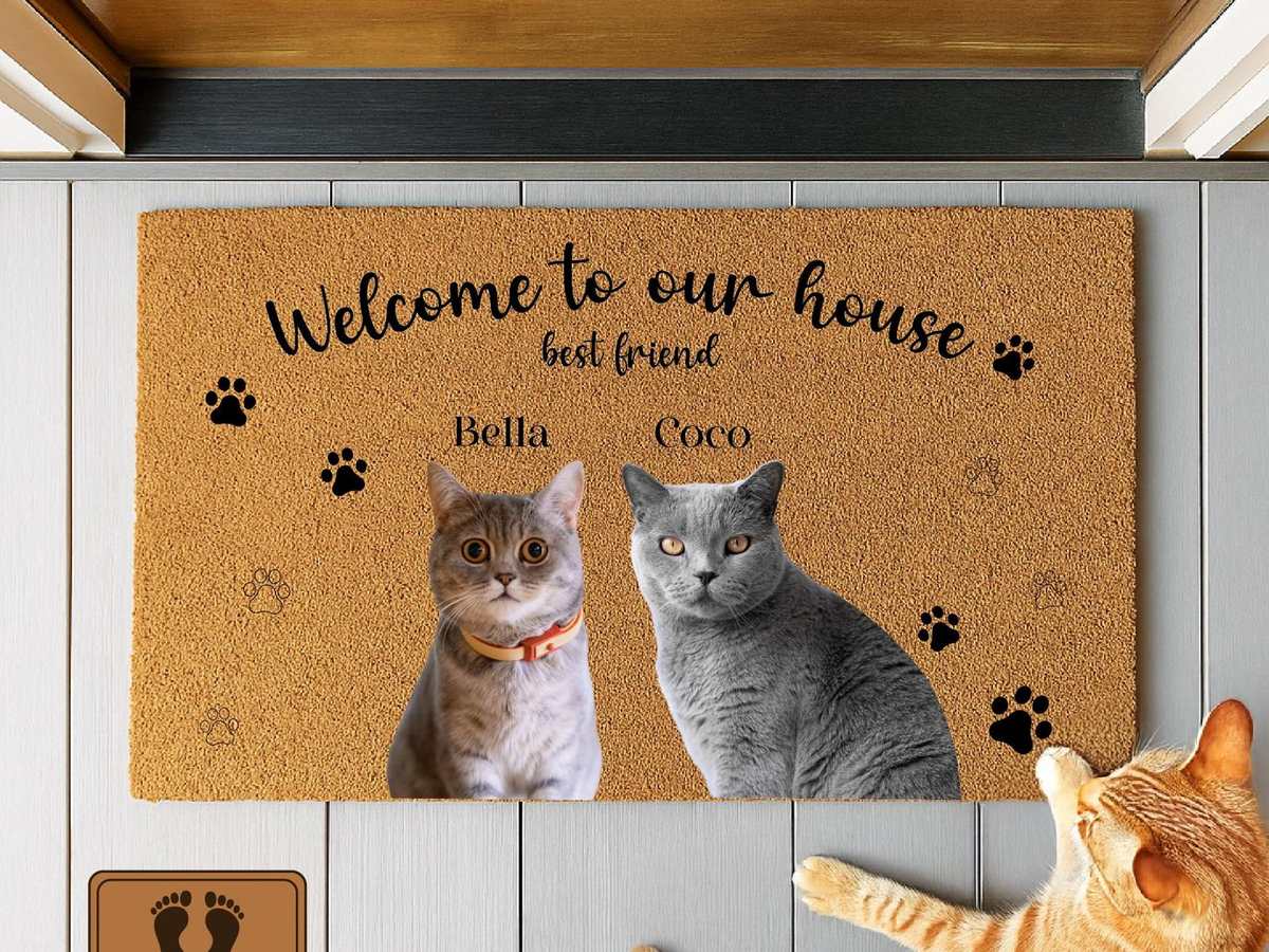 Coir doormat printed with two cat photos and their names, a personalized cat mom gift for the entryway