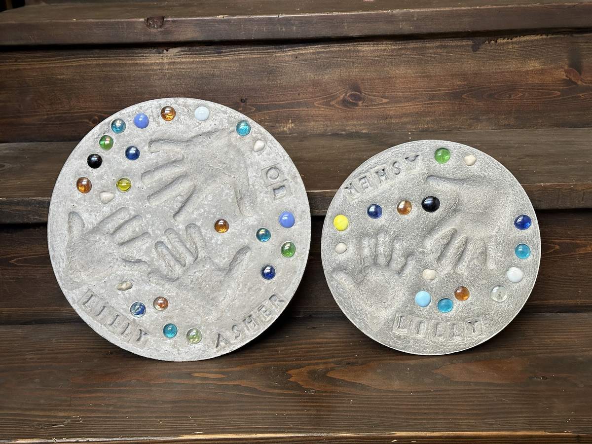 Cast concrete garden stepping stone kit with space for grandchildren's handprints, a gift for grandma