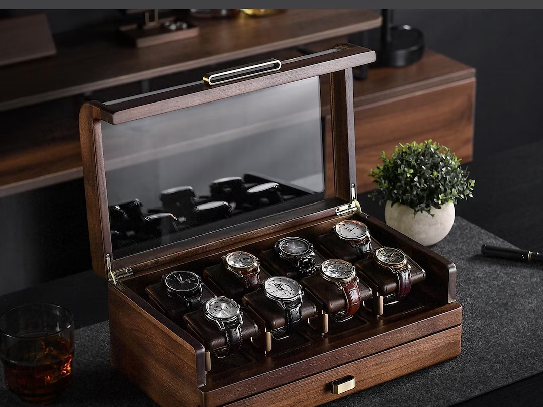 Wooden watch storage case with a glass display lid, engraved on the front