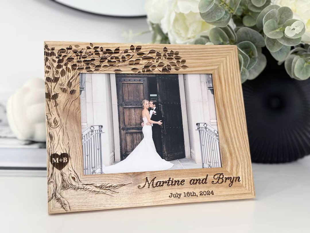 Solid oak photo frame engraved with a couple's first names and their date
