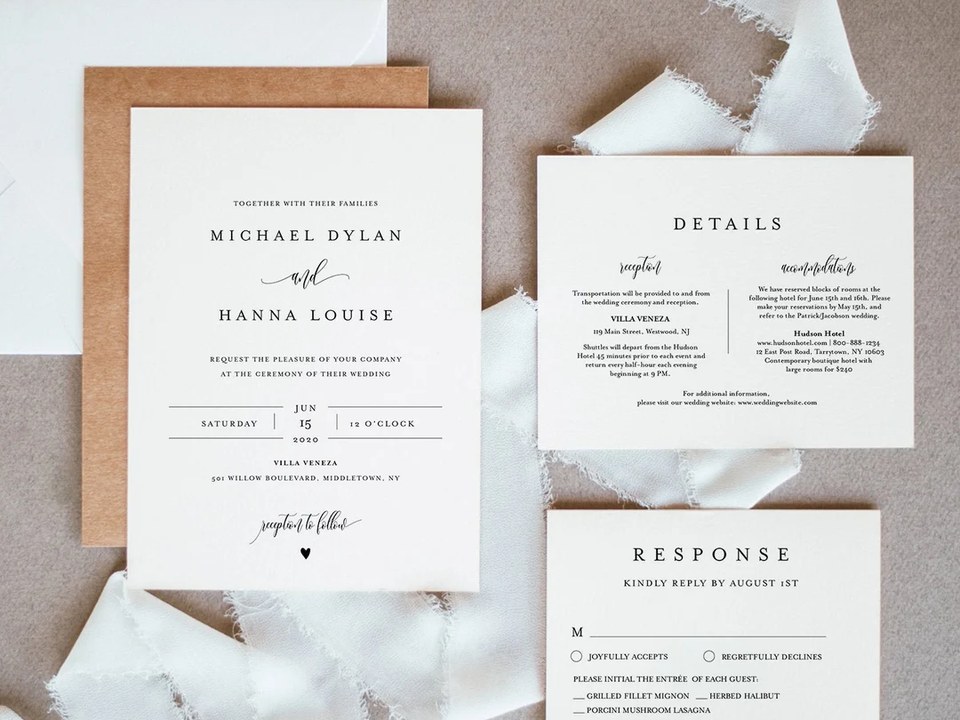 Ivory minimalist wedding invitation with details and RSVP cards on a taupe backdrop with white ribbon