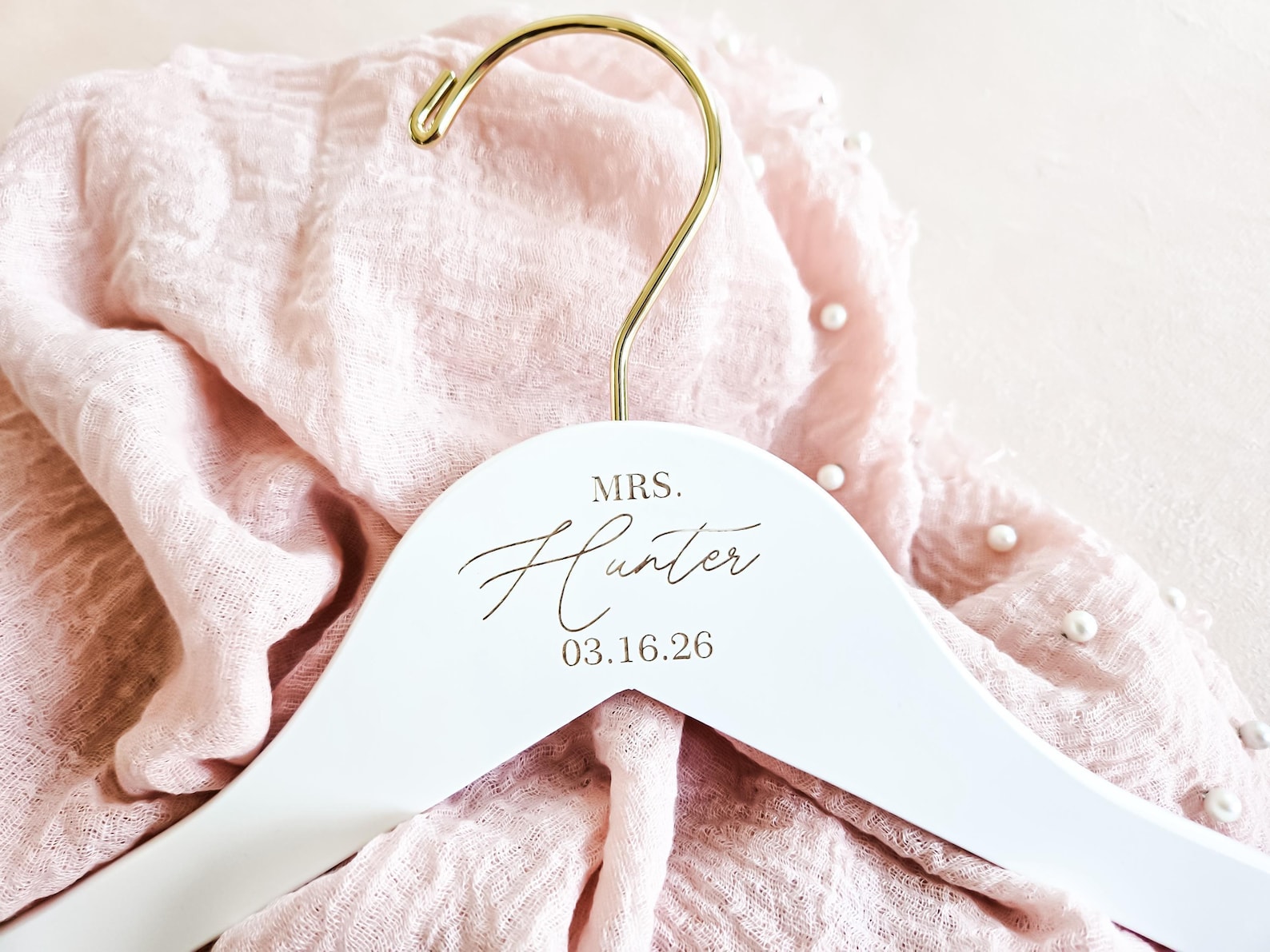 Custom wire bridal dress hanger with the bride's name in script from EverlyGrayce on Etsy