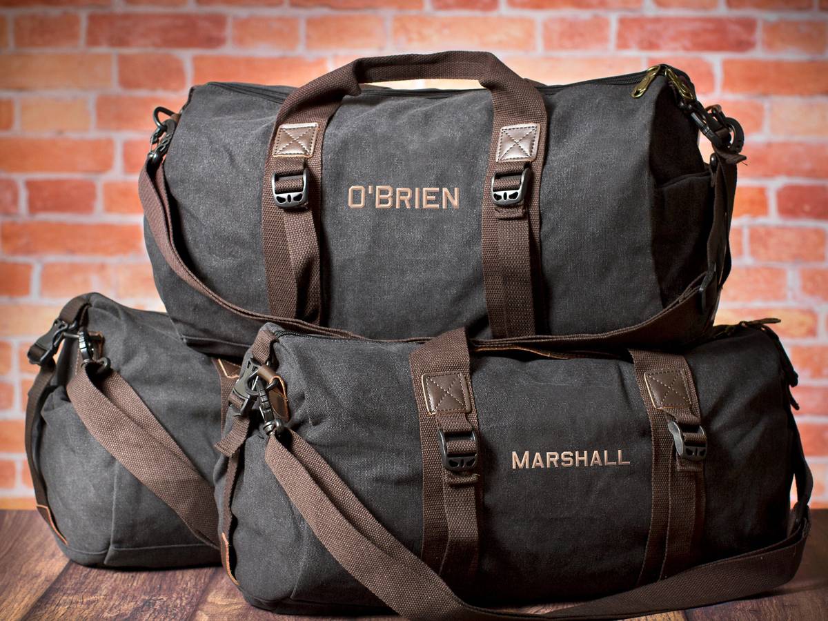 JoyfulTidingsBridal dark duffel bags printed with the names O'Brien and Marshall, a groomsmen wedding gift set on Etsy