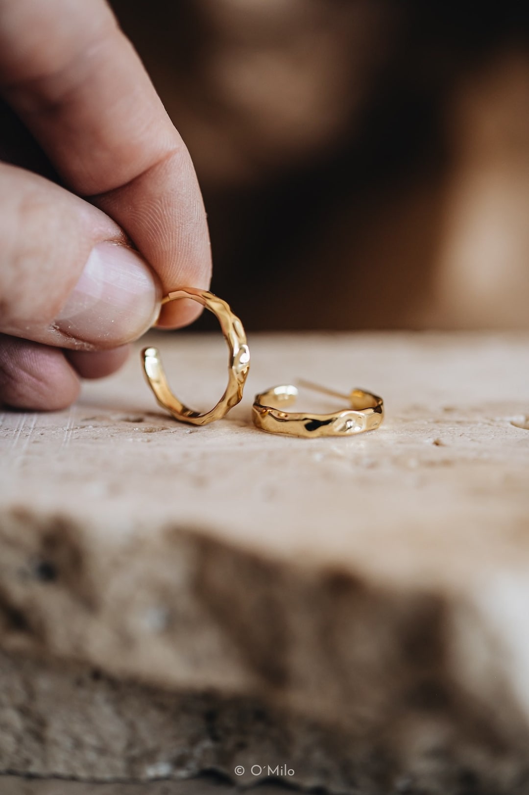 Hand-hammered gold vermeil hoop earrings with a textured surface