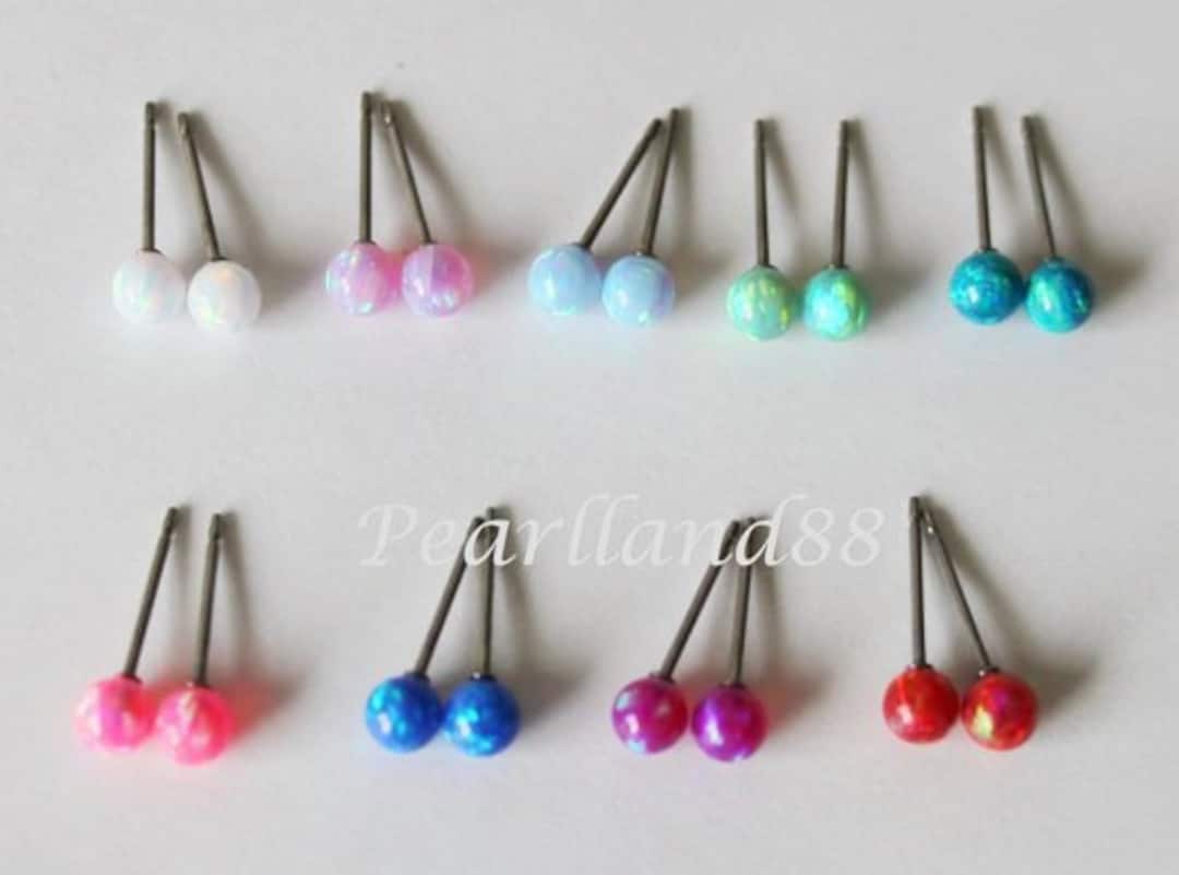 Small fire opal stud earrings on hypoallergenic titanium posts